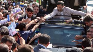 Iranian President Mahmoud Ahmadenijad greets a cheering crowd in Semnan province after Iran successfully tested its Sejile-2 missile (Atta Kenare/AFP/Getty Images)