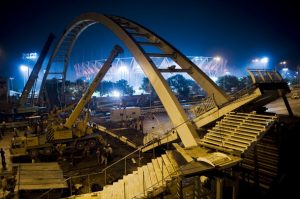 Debris of the collapsed bridge removed near the games arena. (Manpreet Romana/AFP/Getty Images)
