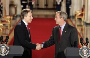 UK Prime Minister Tony Blair shakes hands with fellow war criminal George W. Bush at the White House, November 12, 2004 (White House)