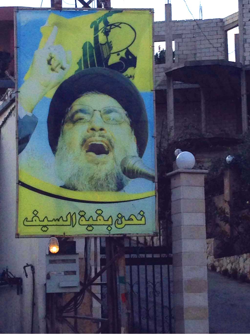 A poster of Hezbollah Secretary General Hassan Nasrallah on a gate in southern Lebanon. (Photo courtesy of the author)